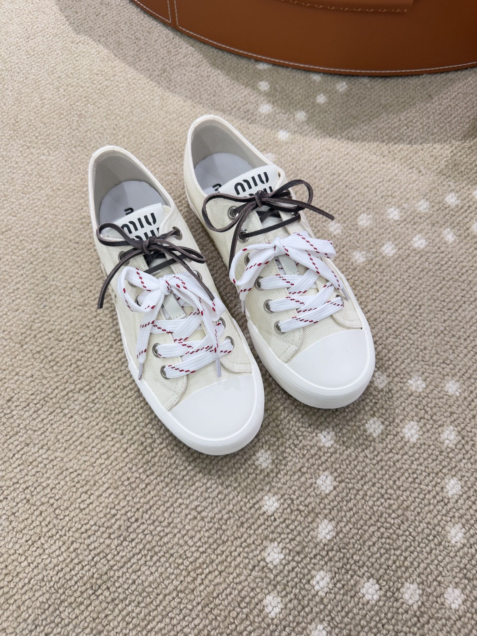 Bagsaaa Miu Miu Washed denim sneakers ivory